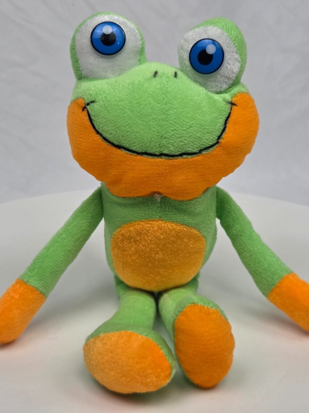 small green and orange plush frog toy 10"